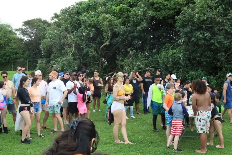 Families gathered at a BJJO beach day